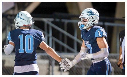 A football player wearing a blue jersey with the number 58 on it. Description generated by AI