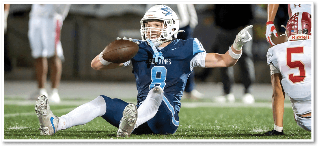 A football player running on the field. Description generated by AI