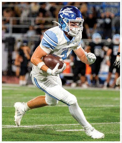 A football player wearing a blue jersey with the number 58 on it. Description generated by AI