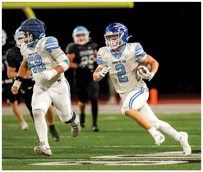 A football player wearing a blue jersey with the number 58 on it. Description generated by AI