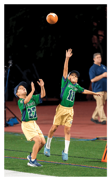 A young man wearing a football jersey with the name Vista on the back. AI generated content