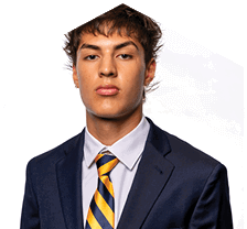 A young man wearing a white jersey with the number 10 on it. Description generated by AI