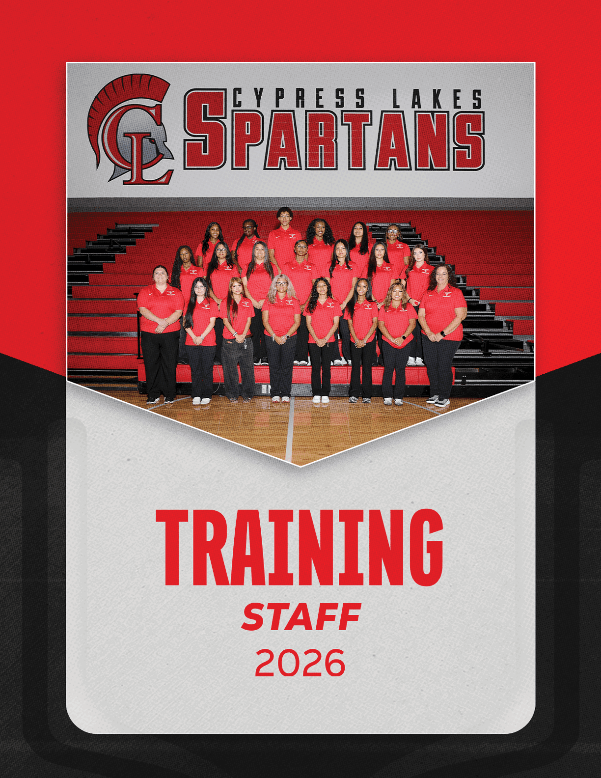 A group of adults wearing red shirts pose seated and standing in bleachers inside a gymnasium with a banner above reading Cypress Lakes Spartans and text below stating Training Staff 2026. Description generated by AI
