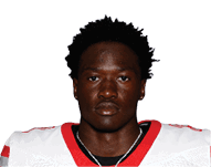 A young man wearing a white jersey with the number 10 on it. Description generated by AI