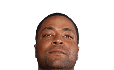A person with short hair is looking slightly upward with a neutral expression against a white background. Description generated by AI