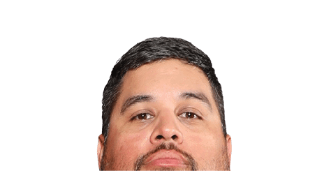 A person with short dark hair and a trimmed beard is looking directly at the camera against a white background. Description generated by AI