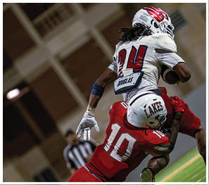 A group of football players celebrating a touchdown. Description generated by AI