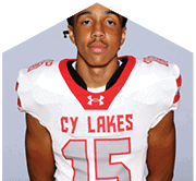 A young man wearing a white jersey with the number 10 on it. Description generated by AI