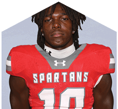 A young man wearing a white jersey with the number 10 on it. Description generated by AI