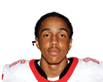 A young man wearing a white jersey with the number 10 on it. Description generated by AI