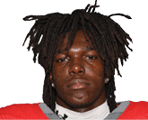 A young man wearing a white jersey with the number 10 on it. Description generated by AI