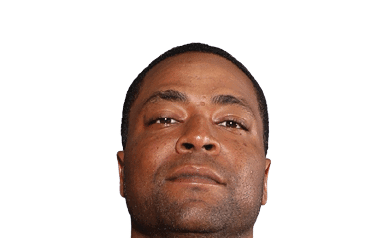 A person with short hair is looking slightly upward with a neutral expression against a white background. Description generated by AI