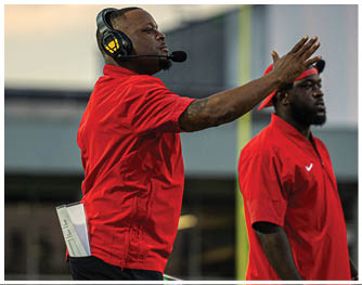 A group of football players celebrating a touchdown. Description generated by AI
