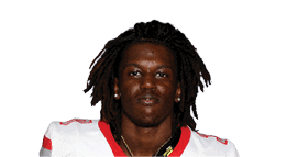 A young man wearing a white jersey with the number 10 on it. Description generated by AI