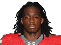 A young man wearing a white jersey with the number 10 on it. Description generated by AI