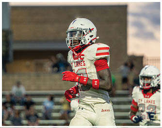A group of football players celebrating a touchdown. Description generated by AI