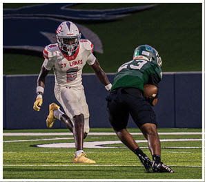 A group of football players celebrating a touchdown. Description generated by AI