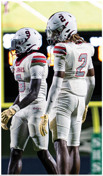 A group of football players celebrating a touchdown. Description generated by AI