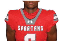 A young man wearing a white jersey with the number 10 on it. Description generated by AI
