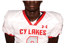 A young man wearing a white jersey with the number 10 on it. Description generated by AI