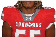 A young man wearing a white jersey with the number 10 on it. Description generated by AI