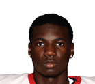 A young man wearing a white jersey with the number 10 on it. Description generated by AI