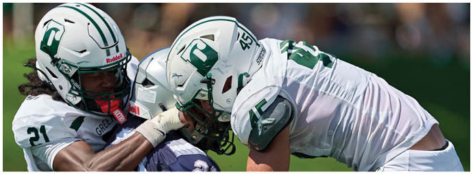 A football game is taking place with players on the field. Description generated by AI