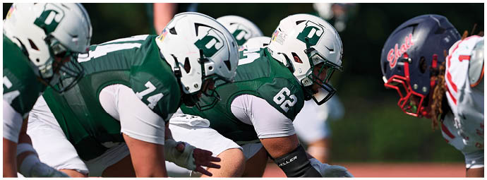 A football game is taking place with players on the field. Description generated by AI