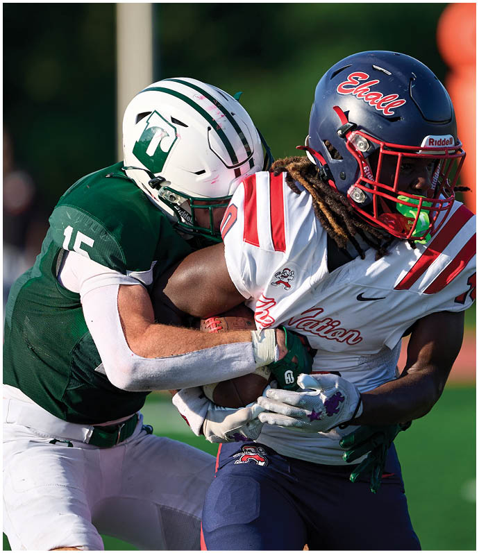 A football player wearing a blue and red jersey. Description generated by AI