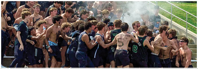 A group of people are sitting in the bleachers. Description generated by AI
