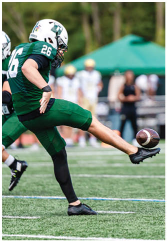 Two football players wearing blue and white uniforms. Description generated by AI