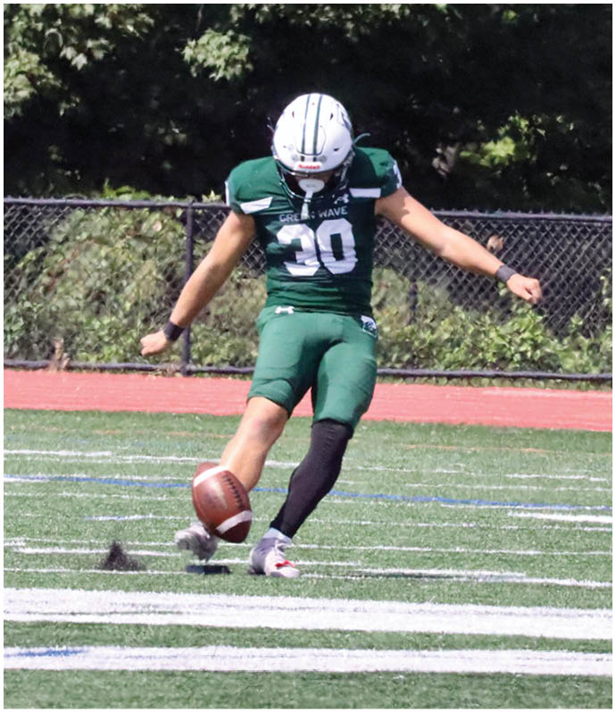 A football player wearing a blue and red jersey. Description generated by AI