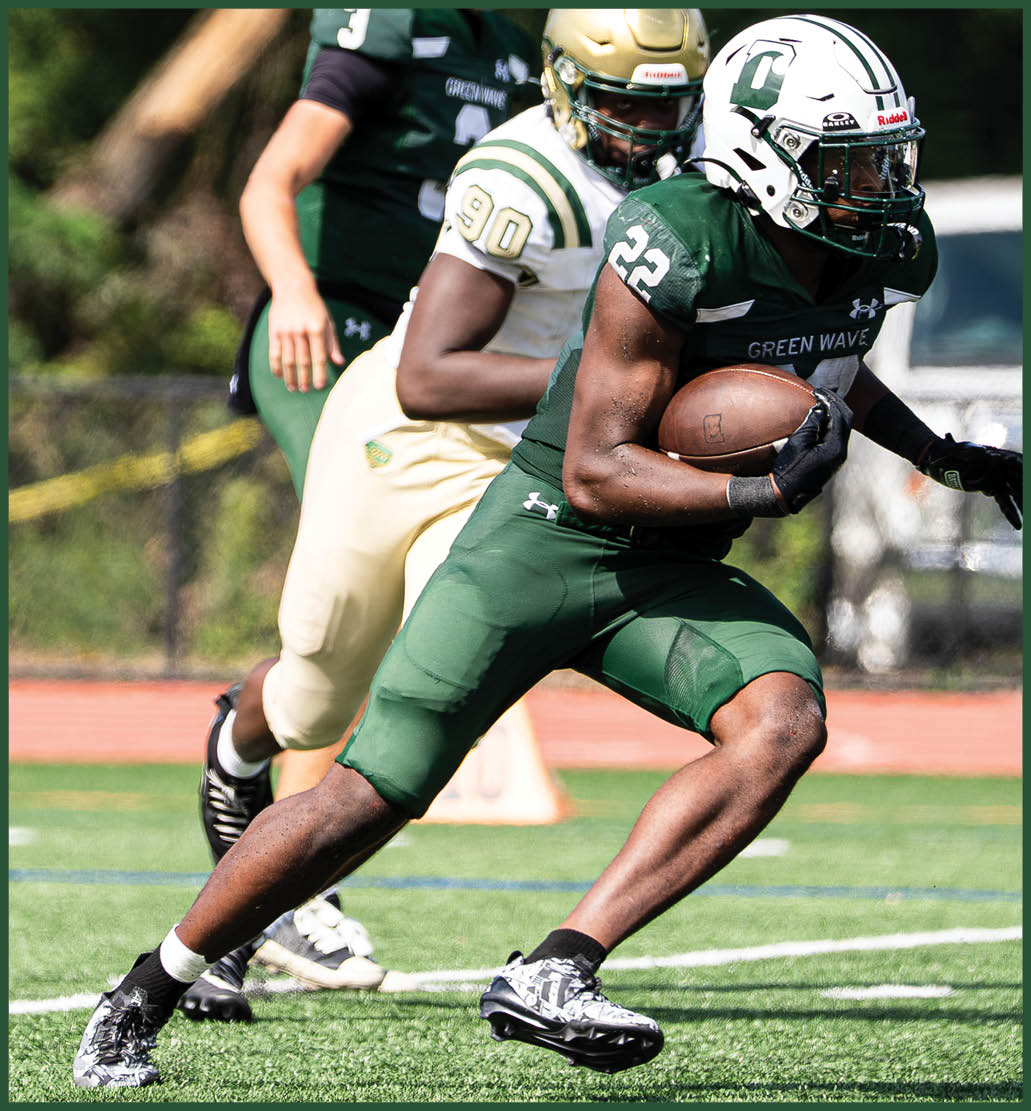 A football player running on the field. Description generated by AI