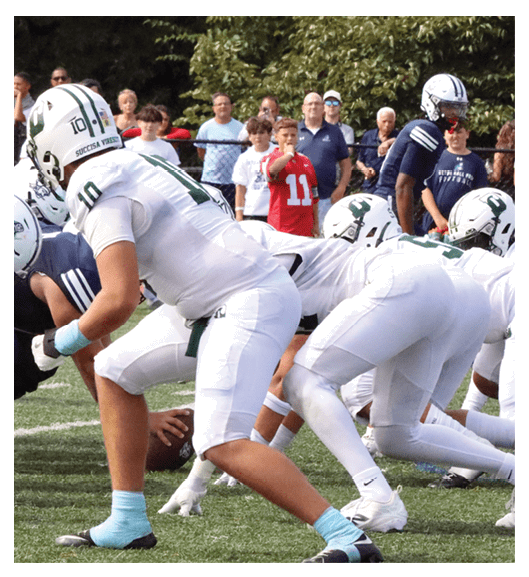 Two football players wearing Vista jerseys and holding hands. AI generated content