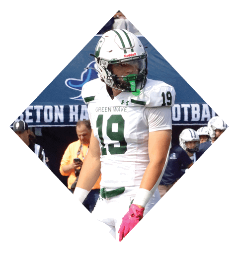 A football player wearing a black jersey with the number 16 on it is holding a football. AI generated content