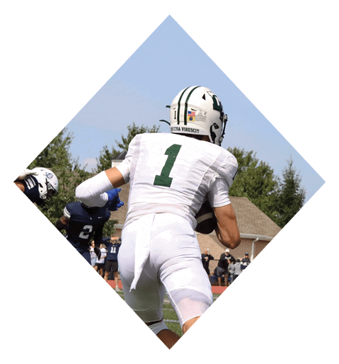 A female football player is kicking a football on a field. AI generated content