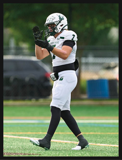 A football player in a white uniform is running with a football in his hand. AI generated content