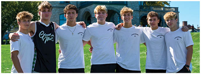 A group of football players on a field. Description generated by AI