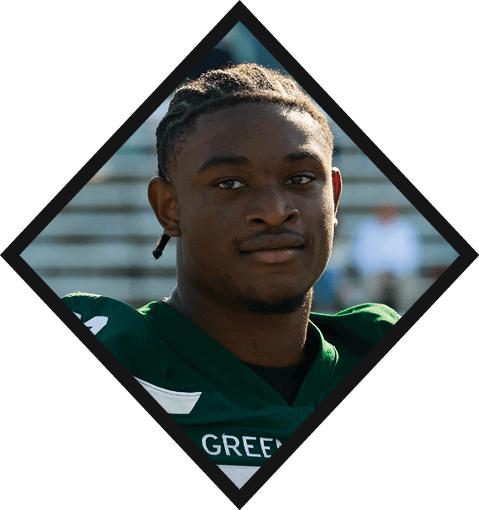 A football player wearing a black jersey with the number 16 on it is holding a football. AI generated content
