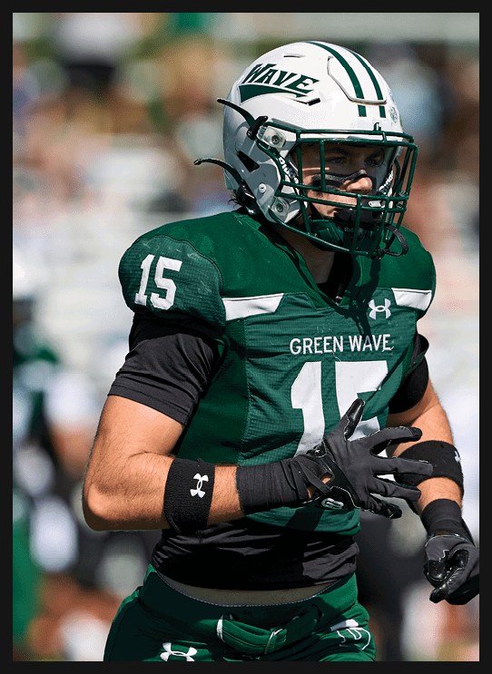 A football player wearing a helmet and white uniform is holding his helmet above his head. AI generated content