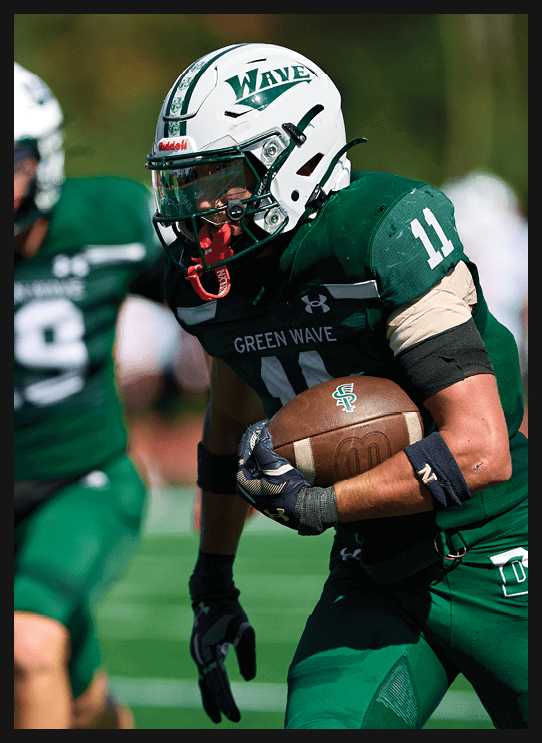 A football player wearing a helmet and white uniform is holding his helmet above his head. AI generated content