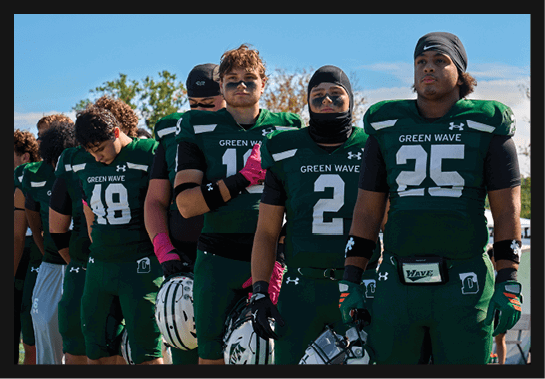 A group of football players wearing headphones and smiling. AI generated content