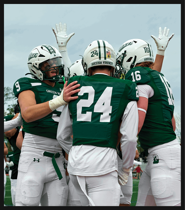 A football game is in progress with players on the field. One player is throwing a football while another player is trying to catch it. The players are wearing uniforms and are actively engaged in the game. AI generated content