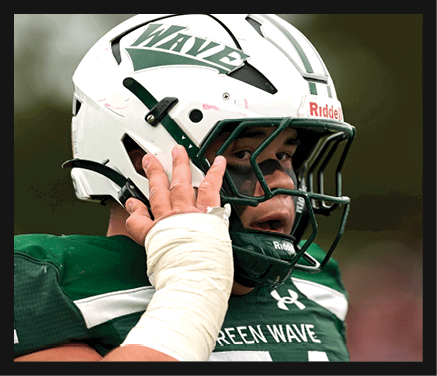 Two football players celebrating a touchdown with one player jumping in the air. AI generated content
