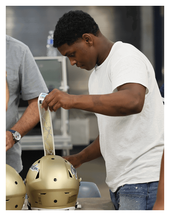 A man is cutting a piece of paper with a pair of scissors. AI generated content