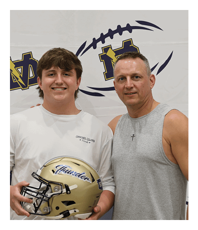 A man and a boy are standing in front of a football. AI generated content