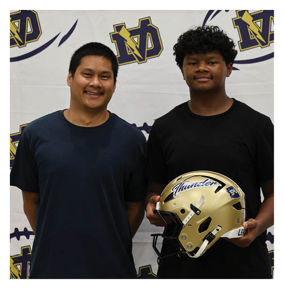 Two men are standing in front of a football. AI generated content