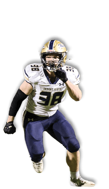 A person wearing a football uniform with the number 98 and a helmet is running forward in an athletic stance. Description generated by AI
