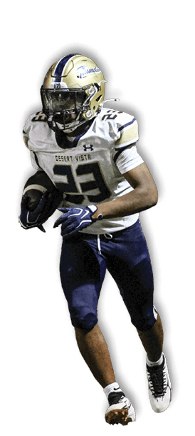 A person wearing a football uniform with a helmet and gloves is running on a field while holding a football. Description generated by AI