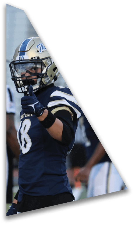 A person wearing a football helmet and uniform is giving a thumbs-up gesture. Description generated by AI